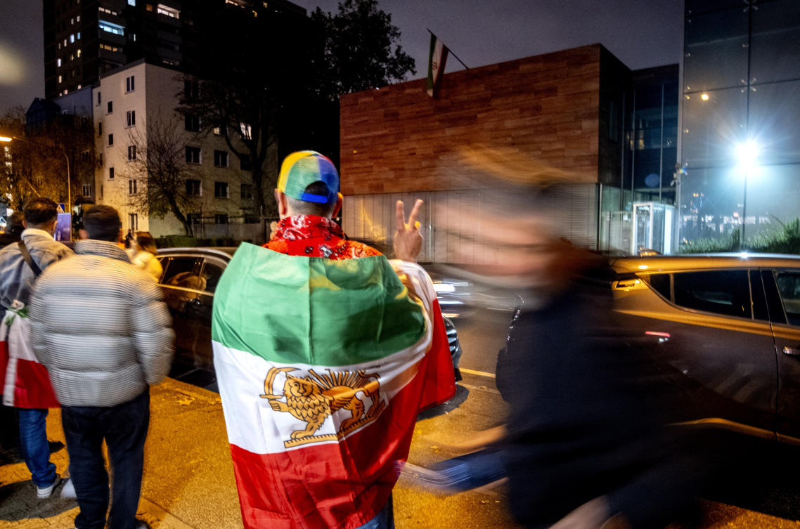 Iranians living in Frankfurt gather in front of the Iranian Consulate that was shut down in response to the execution of Iranian German prisoner Jamshid Sharmahd, who lived in the United States and was kidnapped in Dubai in 2020 by Iranian security forces, in Frankfurt, Germany. (AP)