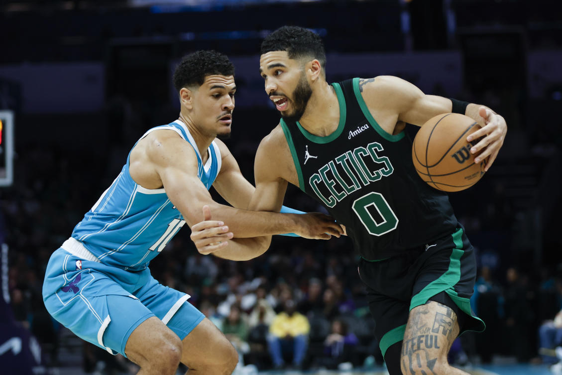 The Boston Celtics, fueled by Jayson Tatum, bounced back from an overtime defeat with a gritty 124-109 victory over the Hornets in Charlotte on Friday. (AP)