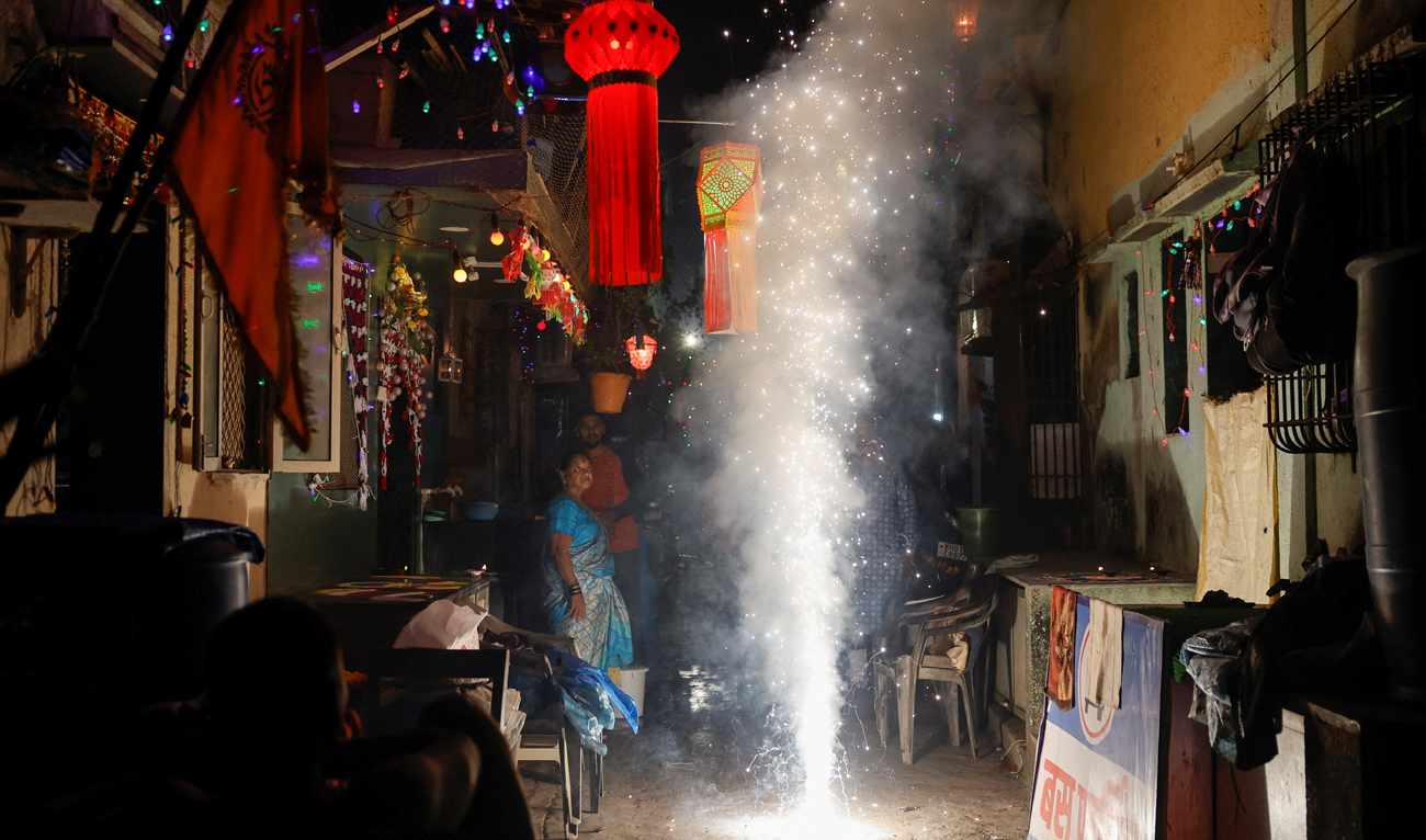People watch fireworks during Diwali, the Hindu festival of lights, in Mumbai, India, November 1, 2024. (REUTERS)