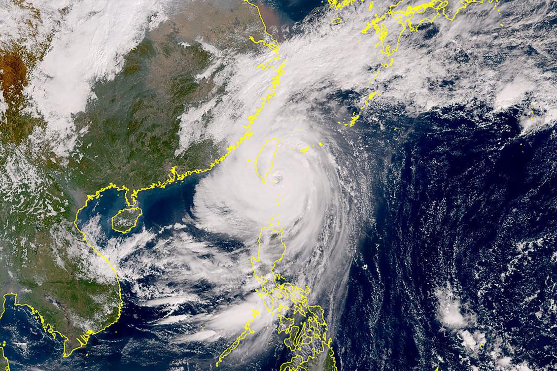 This Himawari satellite handout image from the Japan Meteorological Agency (JMA) website shows typhoon Kong-rey developing over the Pacific as it approaches Taiwan (center L). Taiwan shut down on October 31 as Super Typhoon Kong-rey neared, forcing thousands to flee from one of the most powerful storms to threaten the island in years. (AFP)