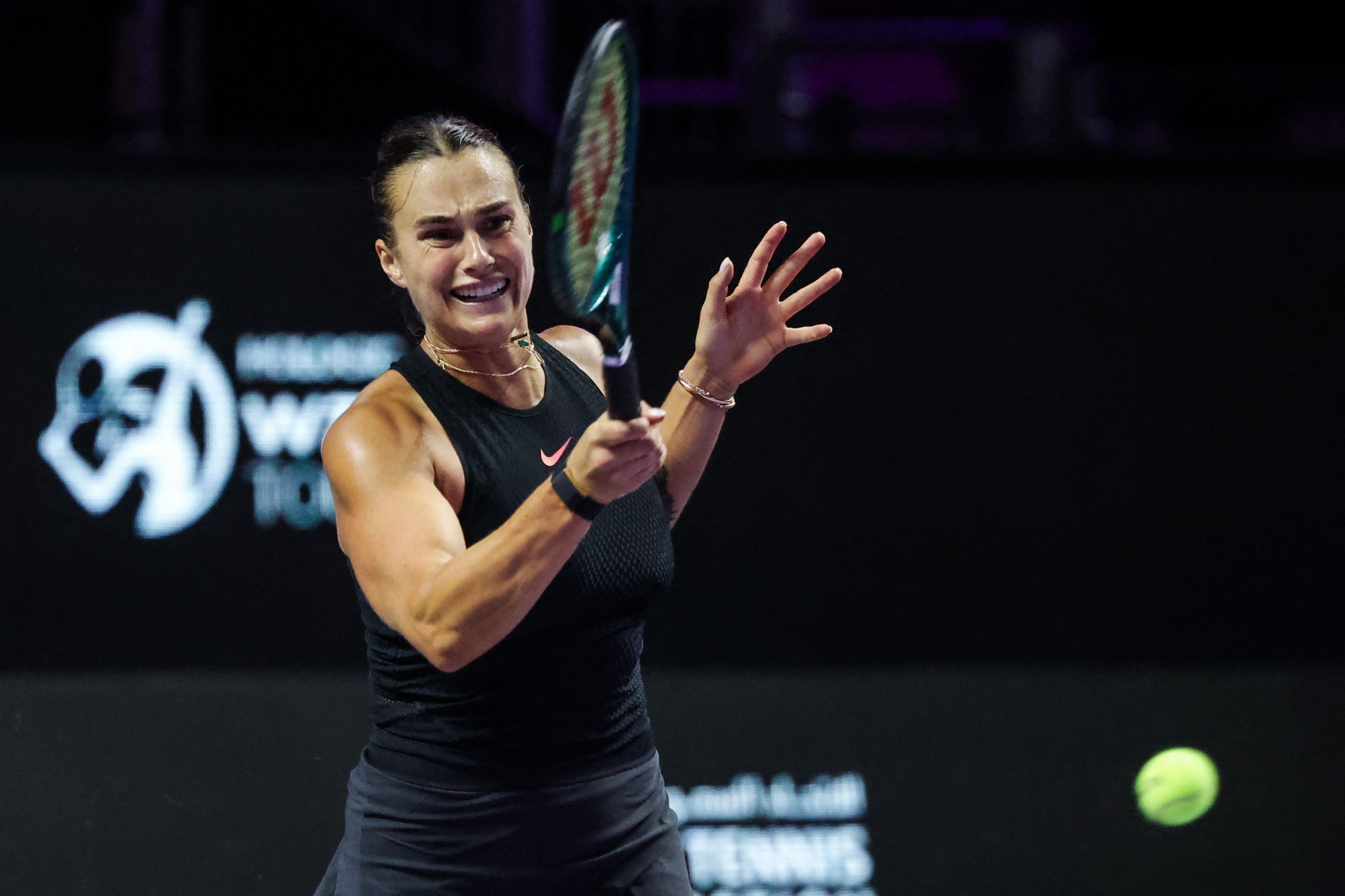 Belarus’ Aryna Sabalenka hits a return against China’s Zheng Qinwen during their women’s singles tennis match at the WTA Finals Championship in Riyadh on November 2, 2024. (AFP)