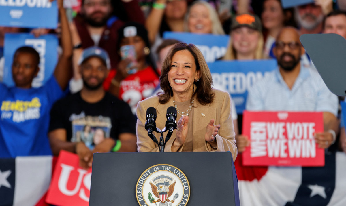 Democratic presidential nominee and US Vice President Kamala Harris applauds during a campaign rally in Charlotte, North Carolina, US, November 2, 2024. (Reuters)