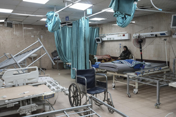 A woman sits on a bed in a room of the Al-Aqsa Martyrs hospital in Deir al Balah, Gaza Strip, on Aug. 25, 2024. (AP/File)
