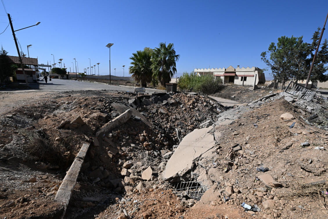 This picture shows a crater caused by an Israeli strike on the road leading to Syria's Jousieh border crossing with Lebanon on October 28, 2024. (AFP)