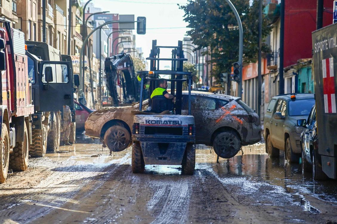 A man removes a flood damaged car in Massanassa, in the region of Valencia, eastern Spain, on November 2, 2024. (File/AFP)