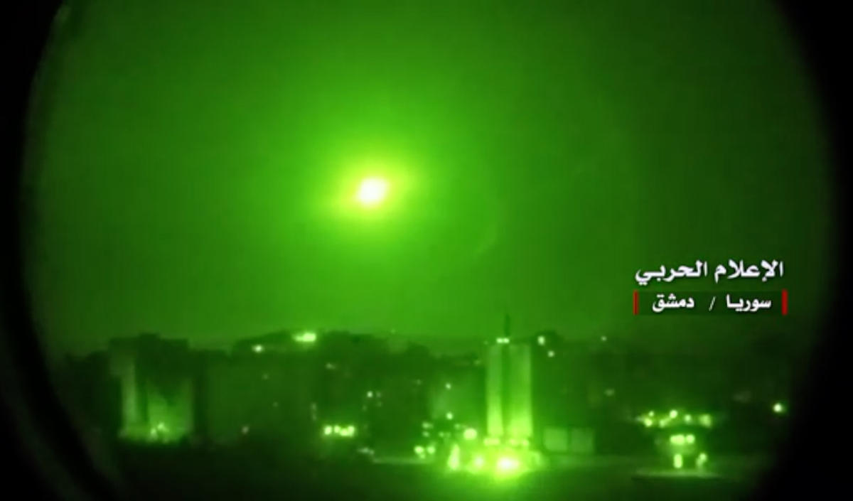 An image grab from a video released on May 10, 2018 by the "Central War Media" and broadcast on Syria's official TV purportedly shows Syrian air defence systems intercepting Israeli missiles over Syrian airspace. (File/AFP)