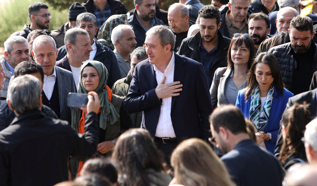 Kurdish party activists take part in a demonstration to protest against the dismissals of three mayors in Mardin, Turkiye, on Tuesday. (Reuters)