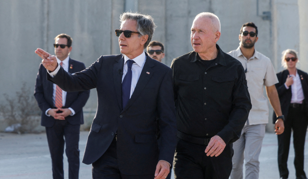 U.S. Secretary of State Antony Blinken gestures as he walks with Israeli Defense Minister Yoav Gallant, at the Kerem Shalom border crossing, Israel, May 1, 2024. (REUTERS)