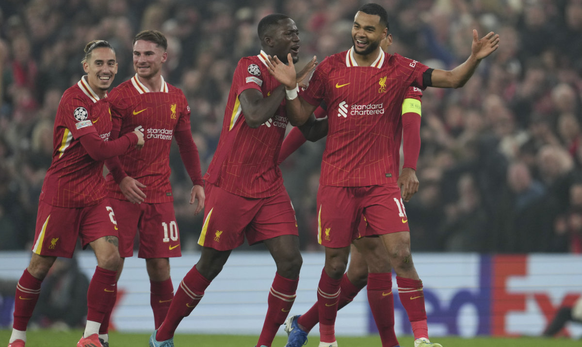 Liverpool's Cody Gakpo, right, celebrates after scoring his side's second goal during the Champions League opening phase soccer match between Liverpool and Bayer Leverkusen at Anfield in Liverpool, England, Tuesday, Nov. 5, 2024. (AP)