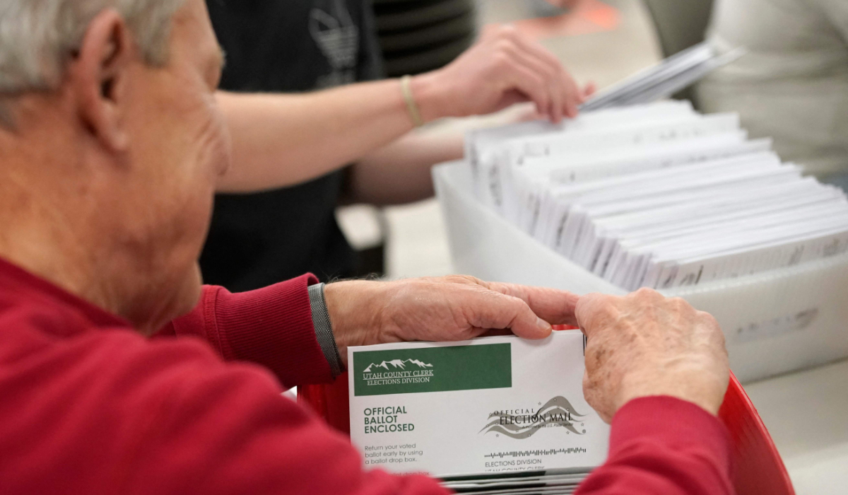 Election volunteers count ballots at the Utah County Ballot Center on November 5, 2024 in Provo, Utah. (AFP)