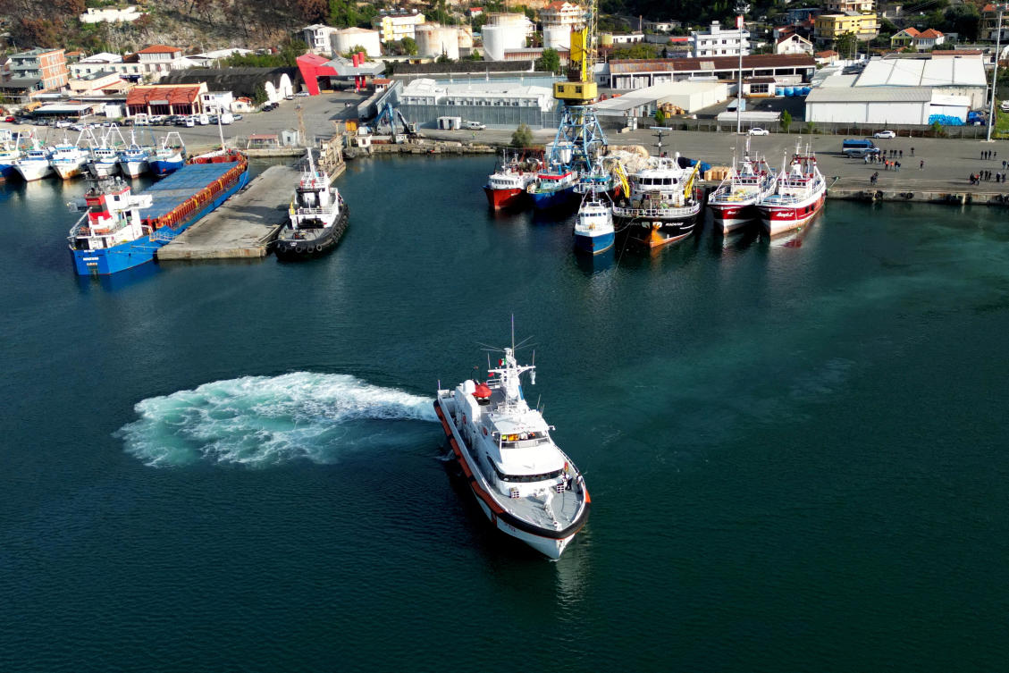 A drone view shows an Italian coast guard vessel departing for Italy with migrants, who were intercepted at sea and later detained at a reception facility in Albania, after a court in Rome overturned their detention orders, in Shengjin, Albania, on Oct. 19, 2024. (Reuters/File)