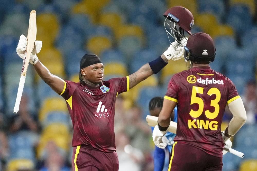 West Indies' Keacy Carty celebrates after he scored a century against England during the third ODI cricket match at Kensington Oval in Bridgetown, Barbados. (AP)