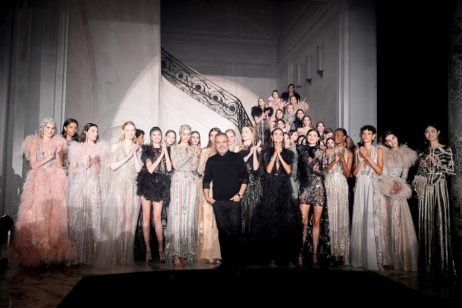 Fashion designer Elie Saab poses with models after the Elie Saab Spring Summer 2018 show as part of Paris Fashion Week in Jan 2018. (Getty Images)