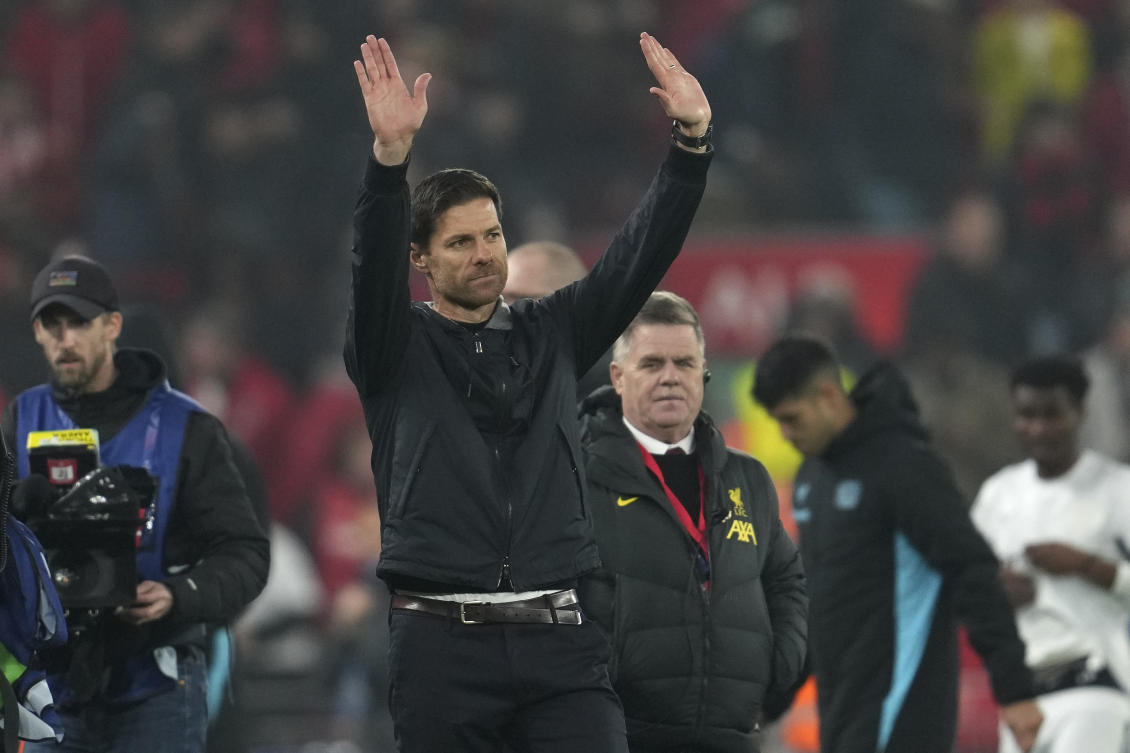 Leverkusen’s head coach Xabi Alonso waves to the crowd at the end of their Champions League opening phase match against Liverpool at Anfield in Liverpool, on Nov. 5, 2024. (AP)