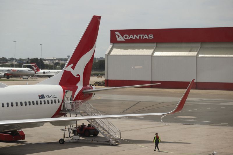 Crew member walks from a Qantas plane at a domestic terminal at Sydney Airport in Sydney, Australia. (File/Reuters)