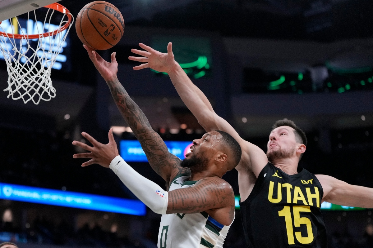 Milwaukee Bucks' Damian Lillard shoots past Utah Jazz's Drew Eubanks during the first half of an NBA basketball game Thursday in Milwaukee. (AP)