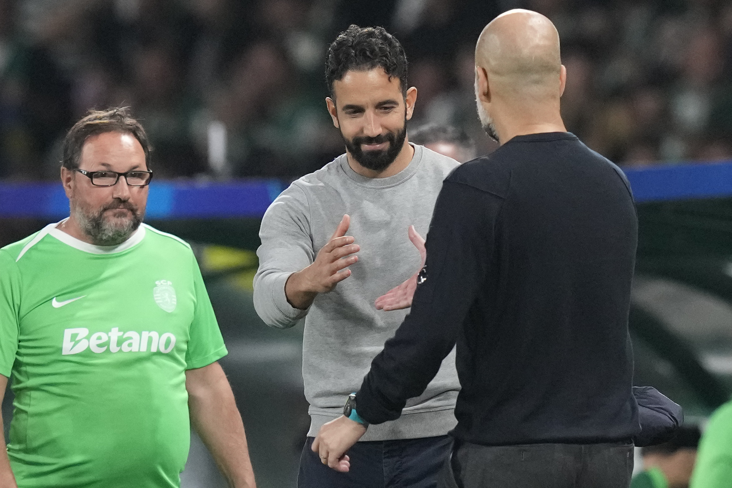 Sporting Lisbon's head coach Ruben Amorim, left, shakes hand with Manchester City's head coach Pep Guardiola after the UEFA Champions League opening phase match between Sporting and Manchester City in Lisbon, Portugal. (AP)