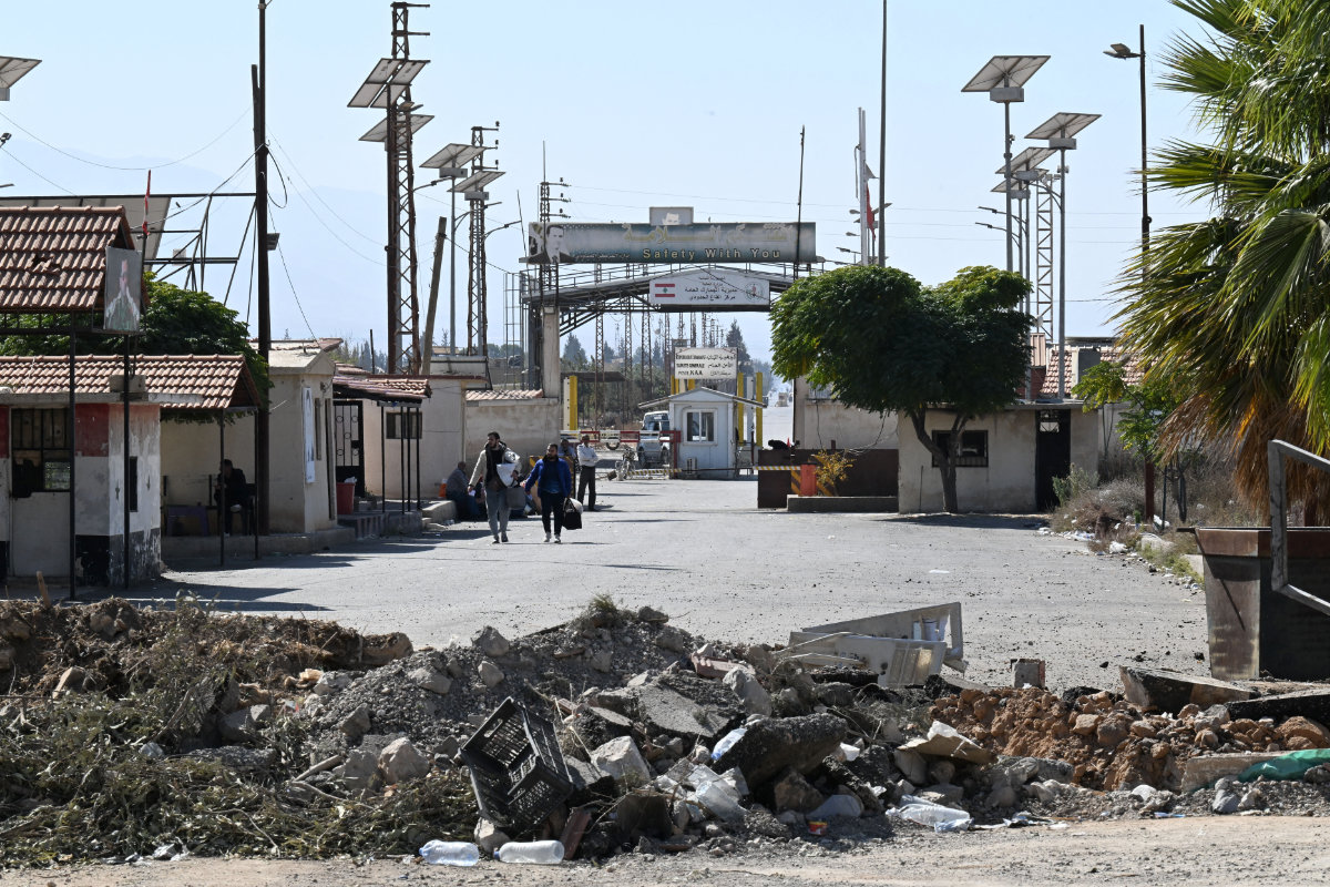 This picture shows a crater caused by an Israeli strike on the road leading to Syria's Jousieh border crossing with Lebanon on October 28, 2024. Another Israeli strike on the countryside of Aleppo and Idlib reportedly injured several Syrian soldiers early Saturday. (AFP/File)