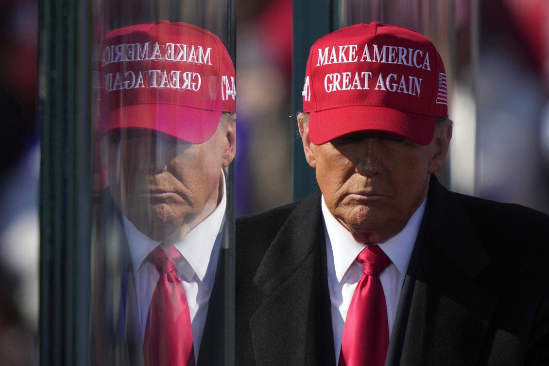 Republican presidential nominee former President Donald Trump is reflected in the bullet proof glass as he finishes speaking at a campaign rally in Lititz on Nov. 3, 2024. (AP)