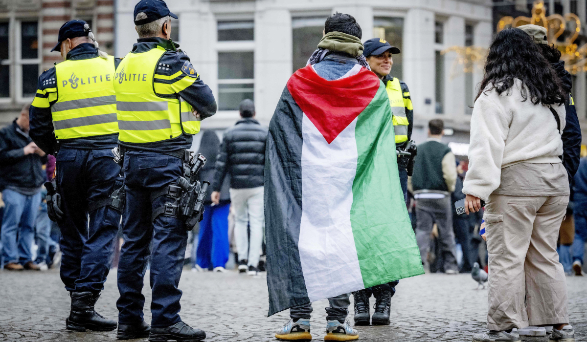 Netherlands' Police officers stand by as people gather during a small pro-Palestinian demonstration on Dam Square in Amsterdam, on November 9, 2024. (AFP)