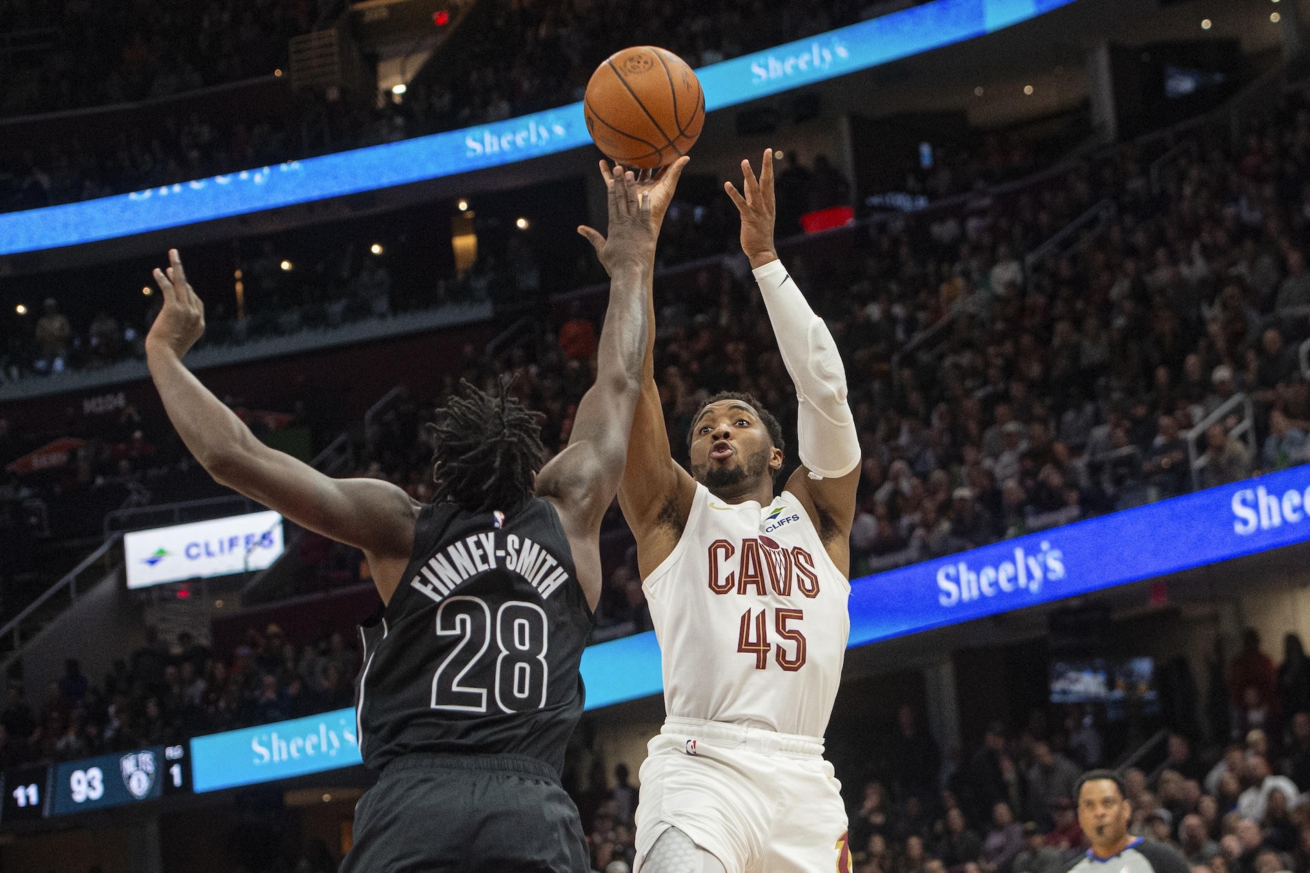 Cleveland Cavaliers’ Donovan Mitchell shoots over Brooklyn Nets’ Dorian Finney-Smith during the second half of an NBA basketball game in Cleveland Saturday. (AP)