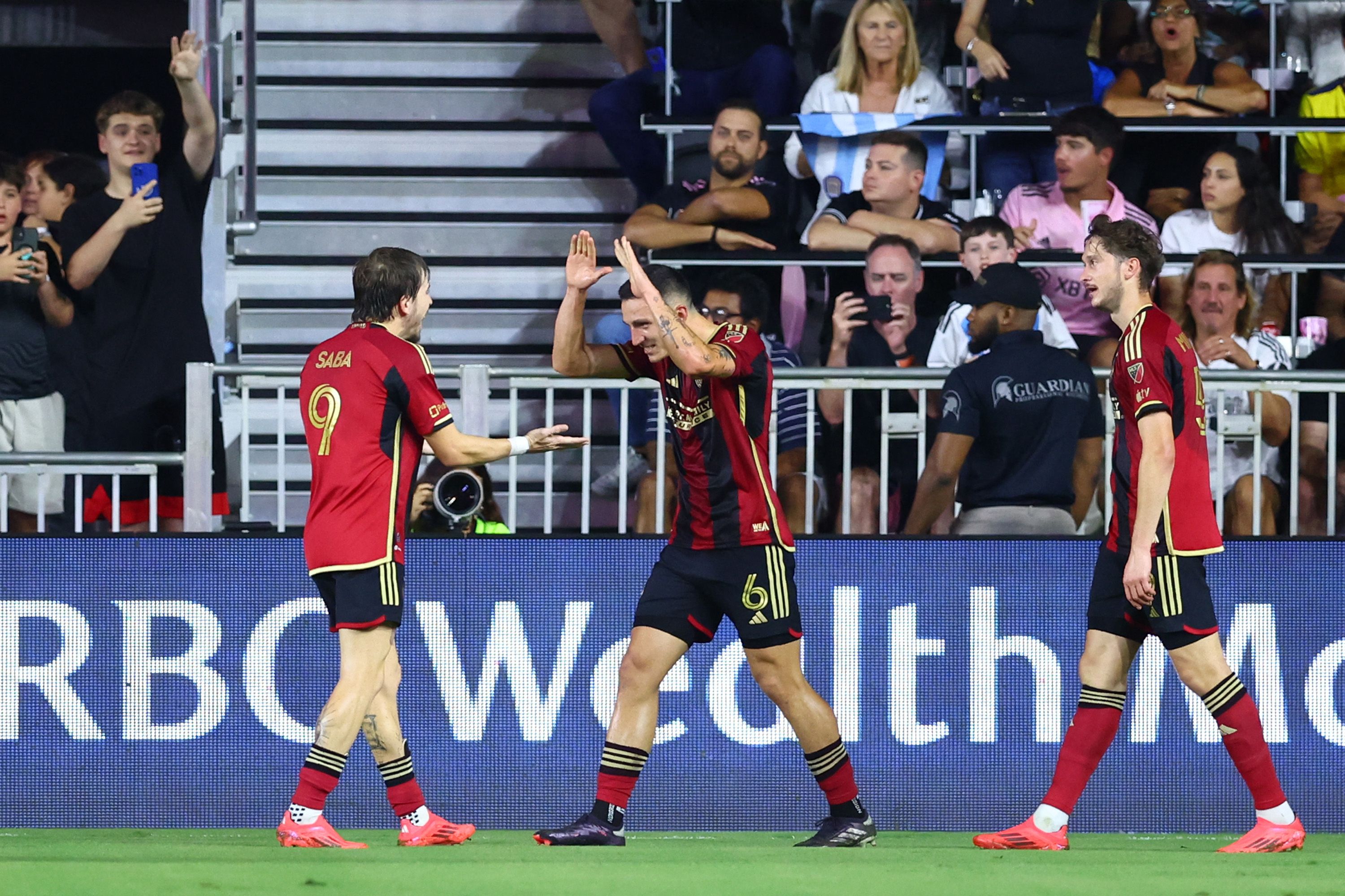 Bartosz Slisz #6 of Atlanta United celebrates after scoring a goal against Inter Miami with Saba Lobzhanidze during the second half of the Audi 2024 MLS Cup playoffs at Chase Stadium on Nov. 9, 2024 in Fort Lauderdale, Florida. (AFP)