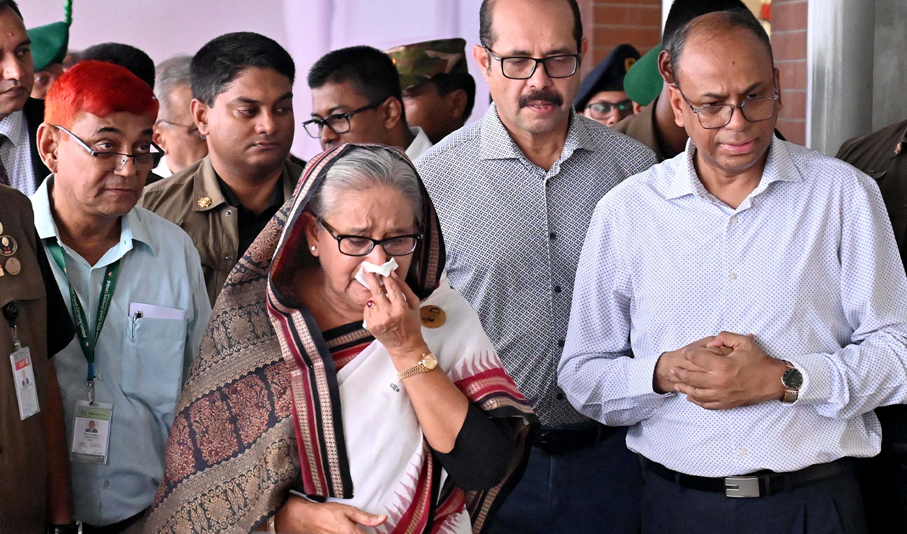 In this photograph taken and released on July 25, 2024 by Bangladesh Prime Minister’s Office, Former PM Sheikh Hasina weeps while she visits a metro station vandalized during the anti-quota protests in Mirpur, Bangladesh. (Bangladesh PMO/File)