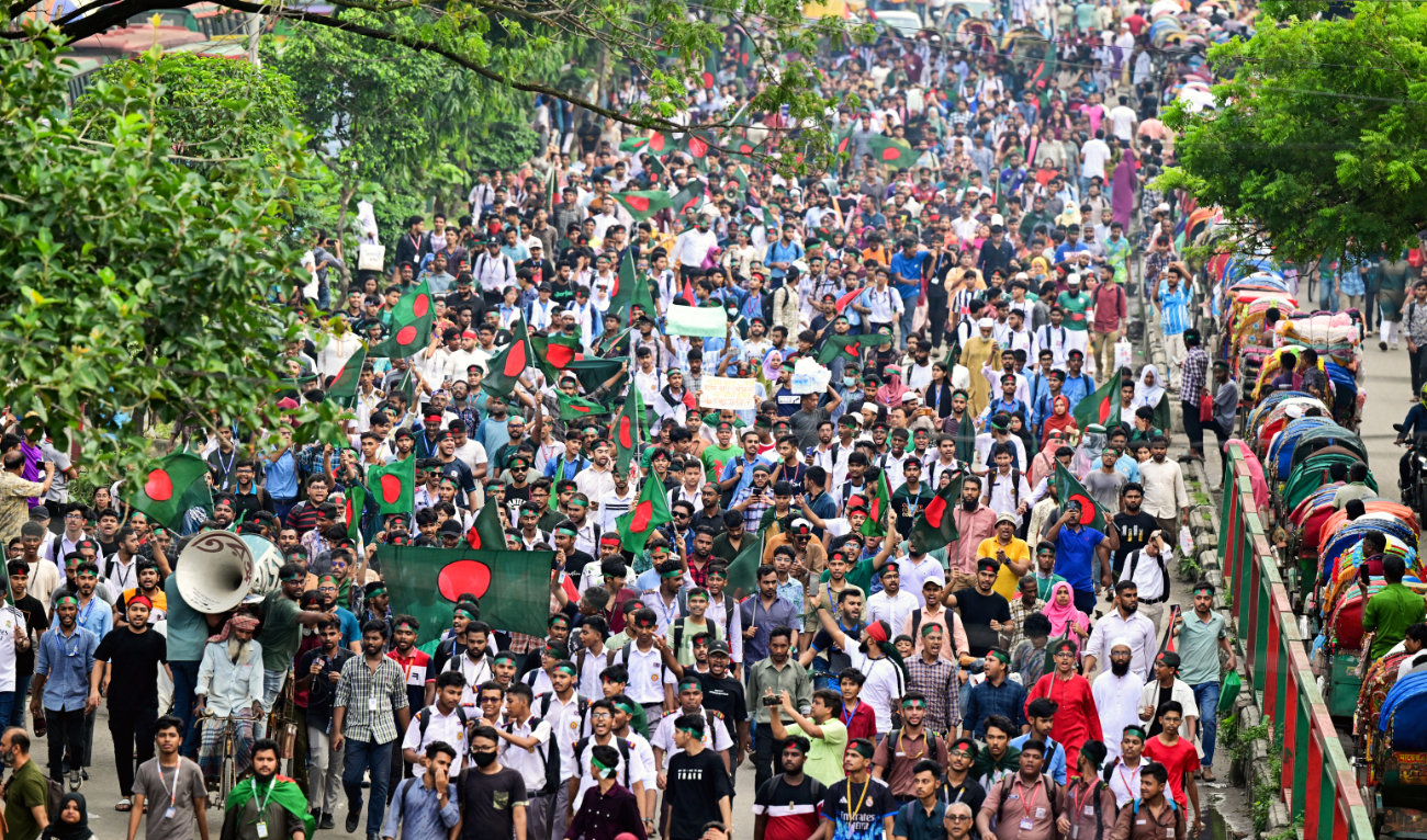Demonstrators wave Bangladesh's national flag during Martyr March, a rally organised by Students Against Discrimination to mark one month to the ousting of the country's former Prime Minister Sheikh Hasina, in Dhaka on September 5, 2024. (AFP/File)