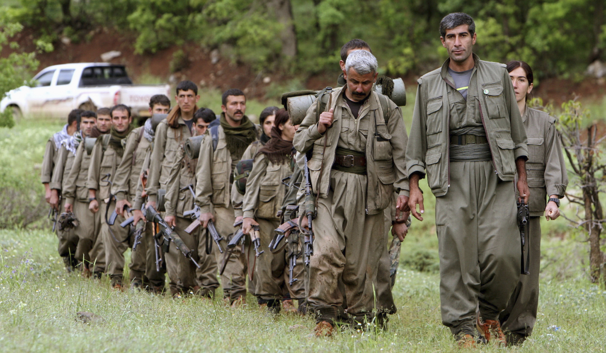 A group of armed Kurdish fighters from the Kurdistan Workers Party (PKK) enter northern Iraq in the Heror area, northeast of Dahuk, 260 miles northwest of Baghdad, Iraq. (AP file photo)