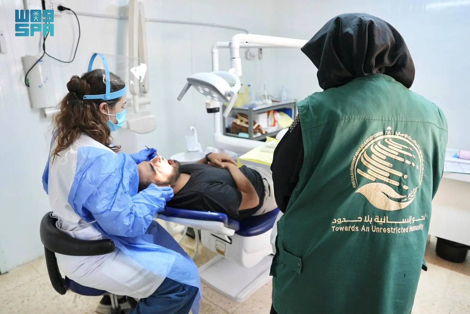 Health workers at a KSrelief medical clinic attend to a patient at the Zaatari camp for Syrian refugees on Sunday. (SPA)