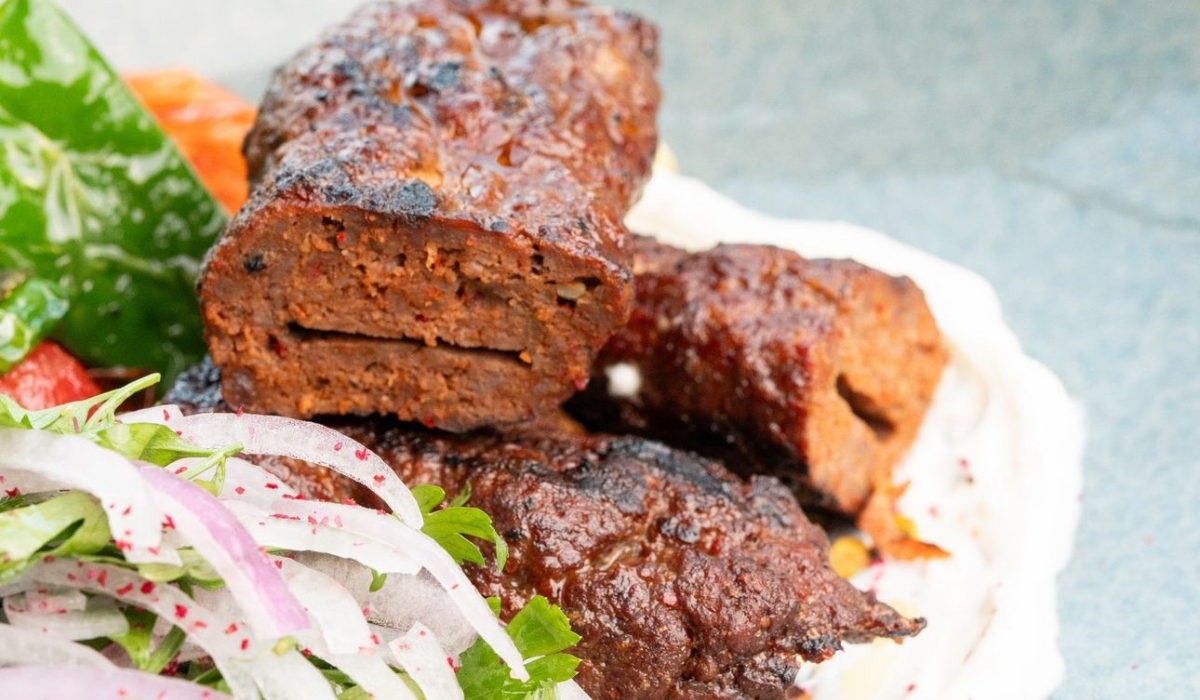 Charcoal-grilled spicy camel kebabs served with lemon yogurt, sumac, and fresh herbs, offering a Middle Eastern twist at Spago by Wolfgang Puck in VIA Riyadh. (Supplied)