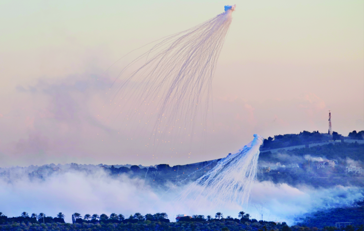 Shells that appears to be white phosphorus from Israeli artillery explode over Dahaira, a Lebanese border village with Israel, south Lebanon, on Oct. 16, 2023. (AP)