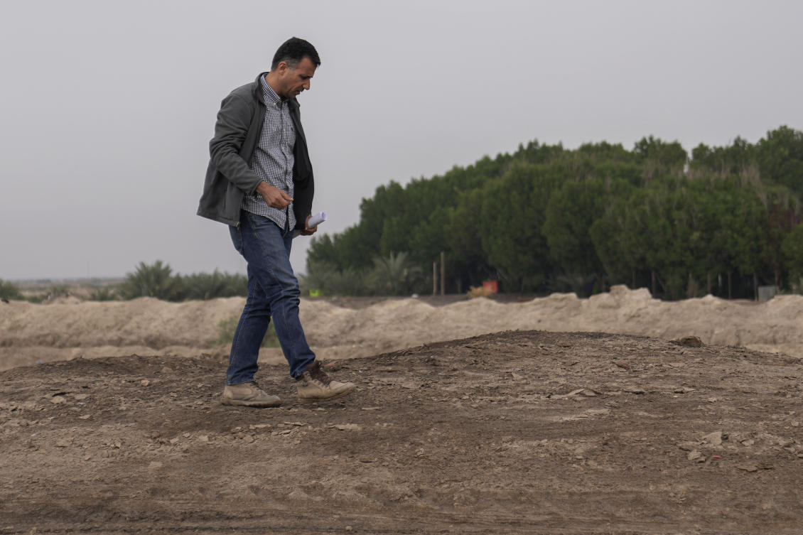 Dr Jaafar al Jotheri holds satellite images and explores the site of the Battle of al-Qadisiyah, which was fought in Mesopotamia - present-day Iraq - in the 630s AD between Arab Muslims and the army of the Sassanid Persian dynasty during a period of Muslim expansion. (AP)