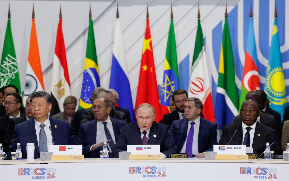 Officials, including South Africa's President Cyril Ramaphosa, Russia's President Vladimir Putin and China's President Xi Jinping, attend a plenary session in the outreach/BRICS Plus format at the BRICS summit in Kazan on October 24, 2024.(AFP)