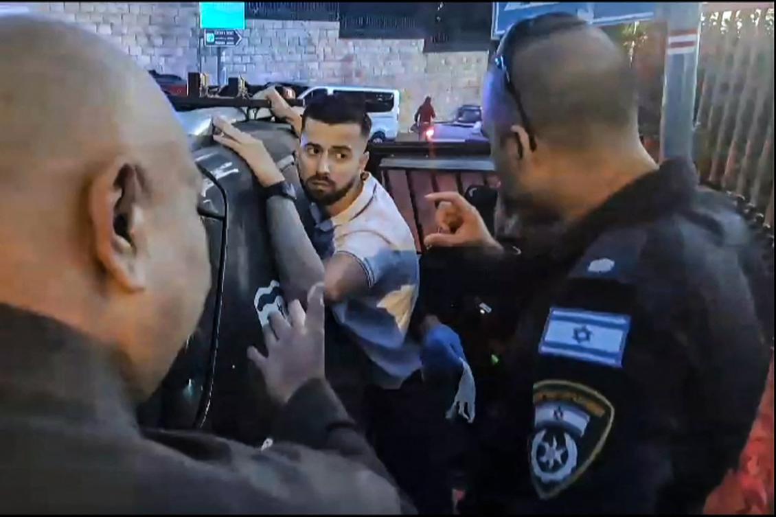 In this grab taken from an AFPTV video footage, Israeli police detain a French gendarme at the Eleona Domain (Church of the Pater Noster) in Jerusalem, on November 7, 2024. (AFP)