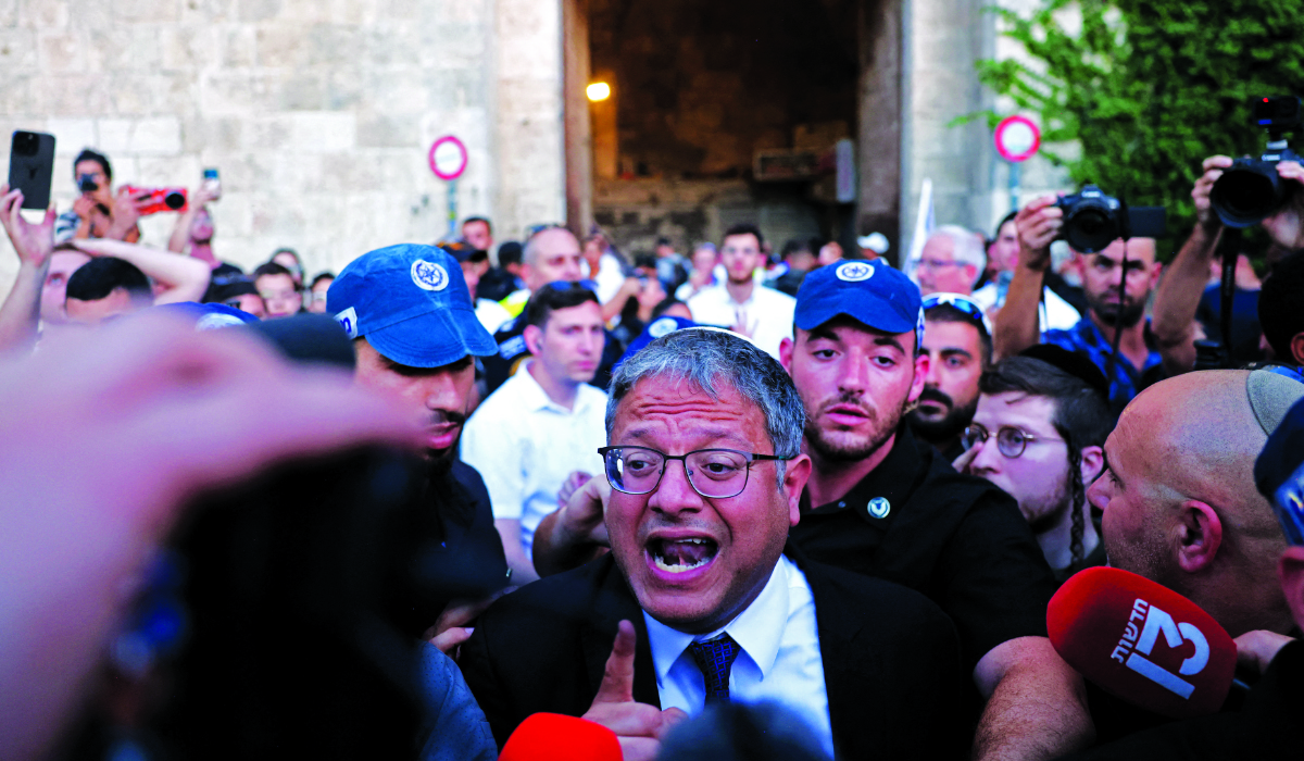 Israel's National Security Minister Itamar Ben-Gvir joins Jewish nationalists, including far-right activists, rallying at Jerusalem's Damascus Gate on June 5, 2024 during the so-called Jerusalem Day flag march, that commemorates the Israeli army's capture in the 1967 Arab-Israeli war of the city's eastern sector, home to the Al-Aqsa mosque compound, Islam's third holiest site, which Jews call the Temple Mount. (AFP)