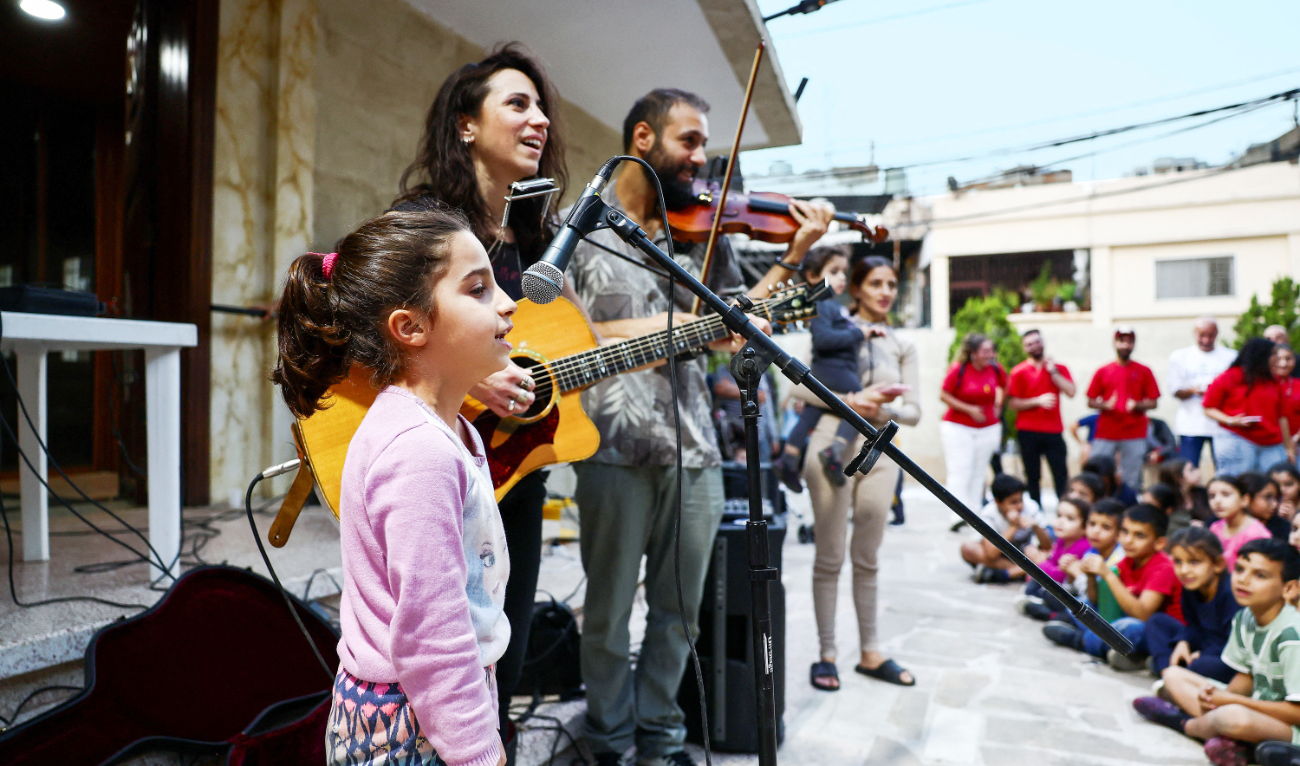 Displaced and refugee children attend a charity event where Lebanese singer Joy Fayad and musician Oliver Maalouf perform in Dbayeh, Lebanon. (Reuters)