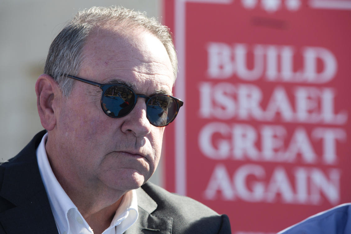 Mike Huckabee before laying a brick at a new housing complex in Efrat settlement in the occupied West Bank on Aug. 1, 2018. (AP/File Photo)