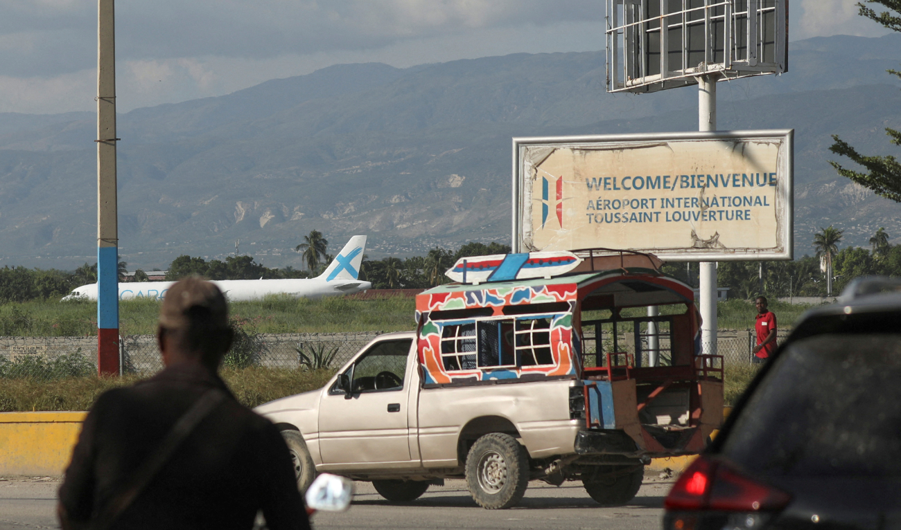 FILE PHOTO: A person walks outside Toussaint Louverture International Airport after airlines suspended flights, in Port-au-Prince, Haiti October 25, 2024. (Reuters/File)