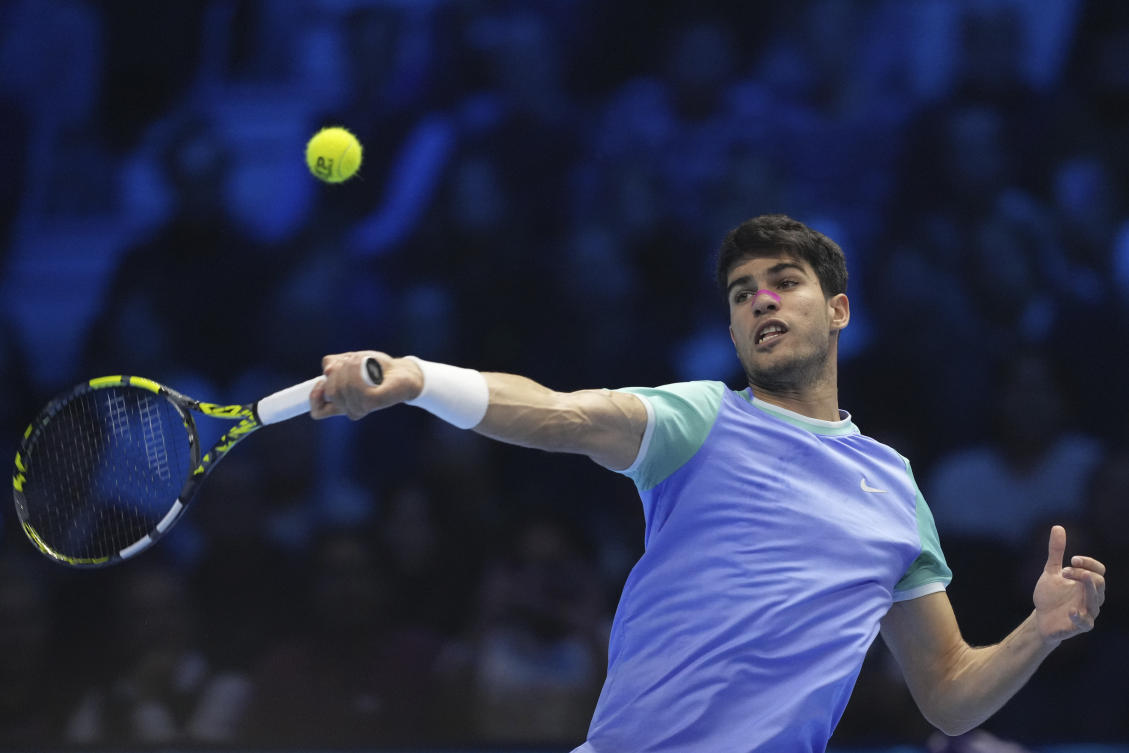 Spain’s Carlos Alcaraz returns the ball to Russia’s Andrey Rublev during their singles tennis match of the ATP World Tour Finals at the Inalpi Arena, in Turin, on Nov. 13, 2024. (AP)