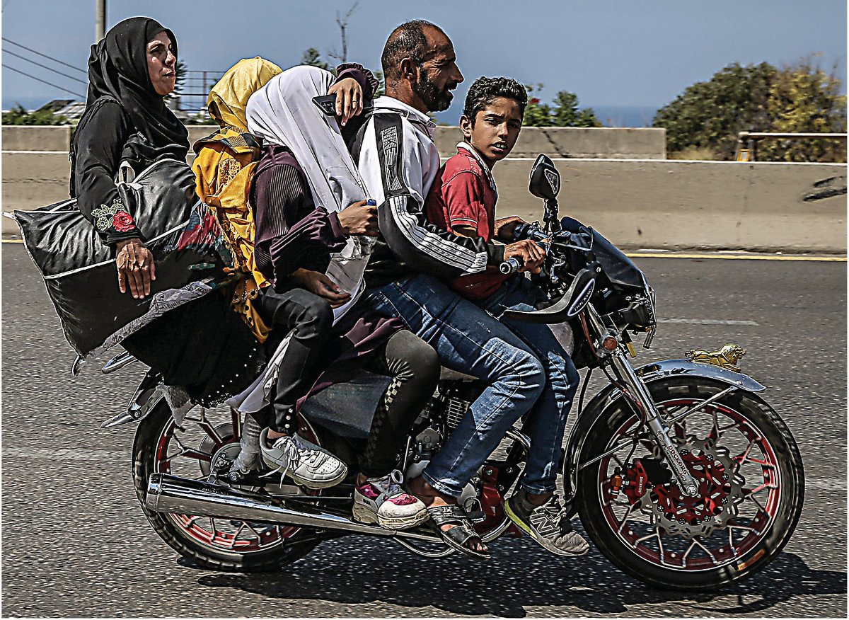Syrian refugee families have been fleeing south Lebanon, main, for the safety of Beirut, following the escalation in Israeli airstrikes. (Getty Images)