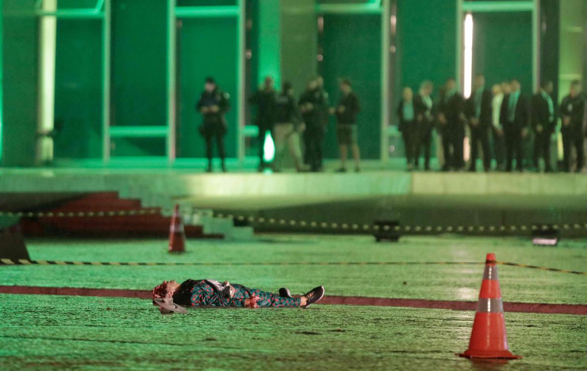 The body of a man who died after an explosion is seen in front of Brazil's Supreme Federal Court in Brasilia, Brazil. (AFP)
