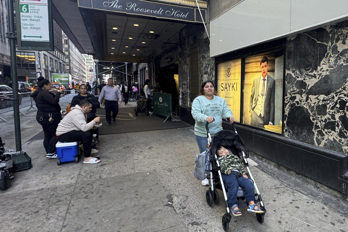 Maribel Hidalgo, an immigrant from Venezuela, pushes a stroller carrying her son outside the Roosevelt Hotel immigration shelter in New York on Nov. 6, 2024. (AP)