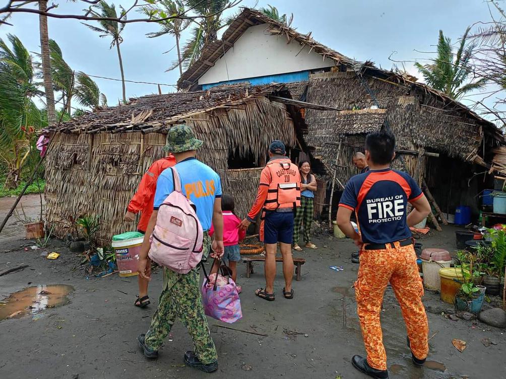 Rescuers fetch residents during a forced evacuation operation in Buguey town, Cagayan province ahead of Super Typhoon Usagi’s landfall on Nov. 14, 2024. (Buguey Municipal Disaster Risk and Reduction Management Office via Cagayan Provincial Public Information/AFP)