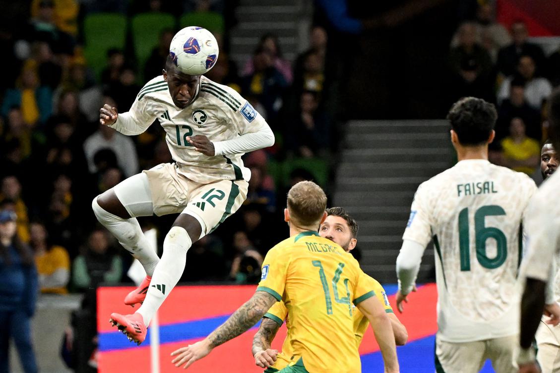 Saudi Arabia’s Saud Abdulhamid heads the ball during the 2026 AFC World Cup qualifier against Australia at the Melbourne Rectangular Stadium in Melbourne, Australia, Nov. 14, 2024. (AFP)