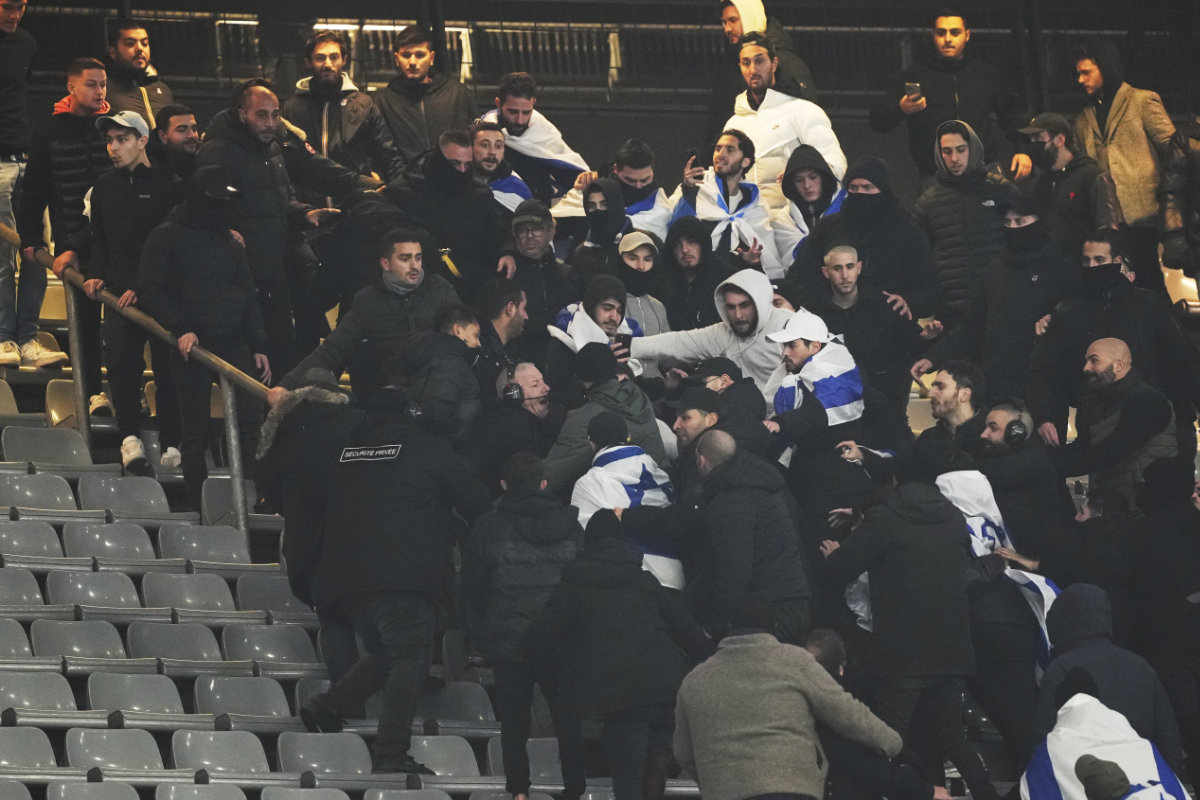 Fans argue on stands during the UEFA Nations League soccer match between France and Israel at the Stade de France stadium in Saint-Denis, outside Paris, on Nov. 14, 2024. (AP)