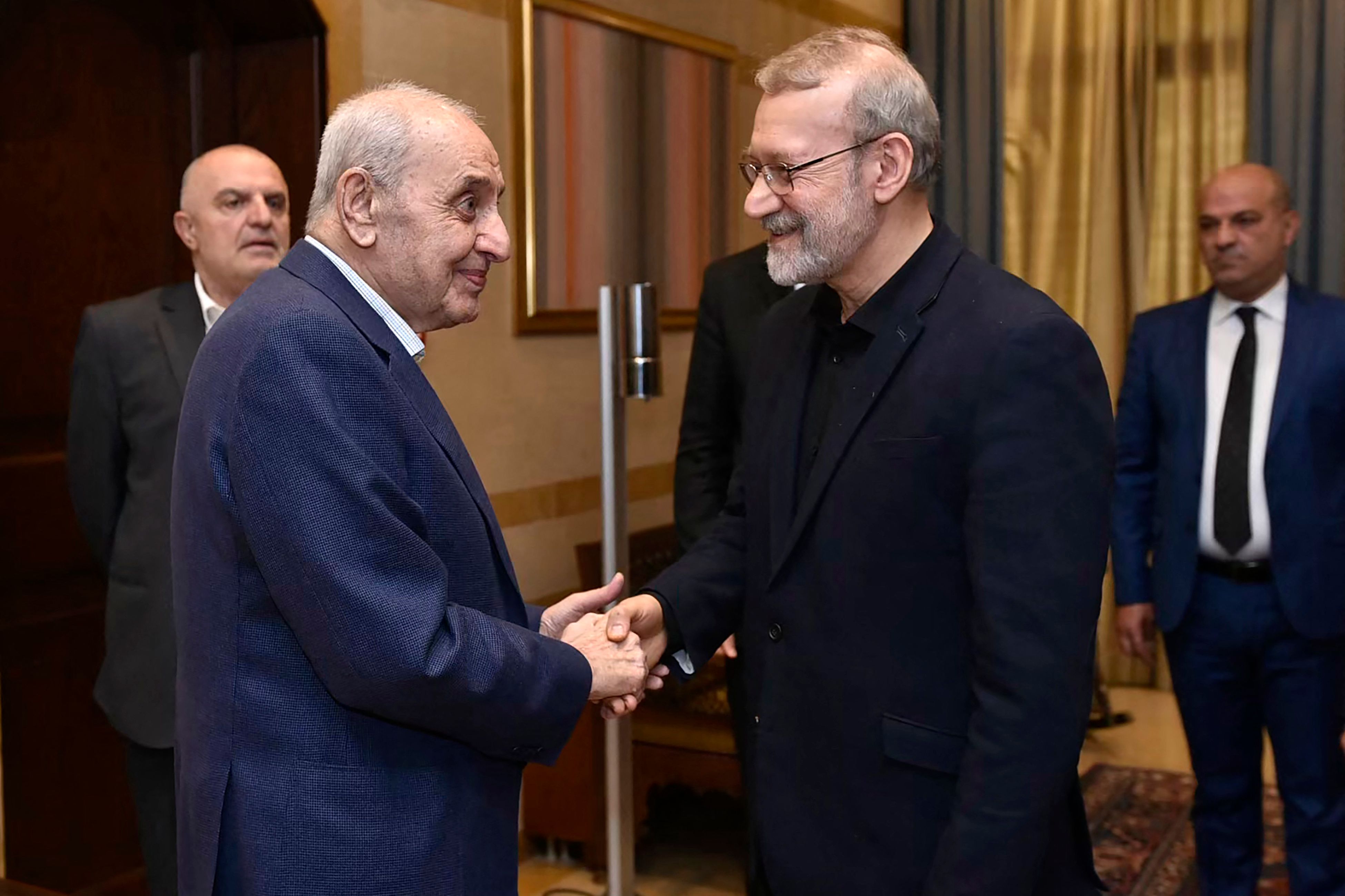 Senior adviser to Iran’s supreme leader Ali Larijani (R) meets with Lebanon’s Parliament Speaker Nabih Berri (L) in Beirut on November 15, 2024, amid the ongoing war between Israel and Hezbollah. (AFP)