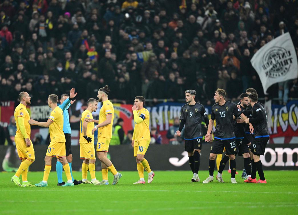 Kosovo's players argue with Romania's players before leaving the pitch. (AFP)