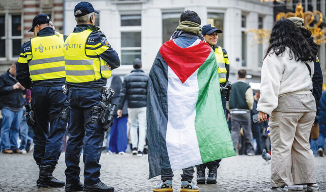 Dutch government survives dispute over Amsterdam violence
