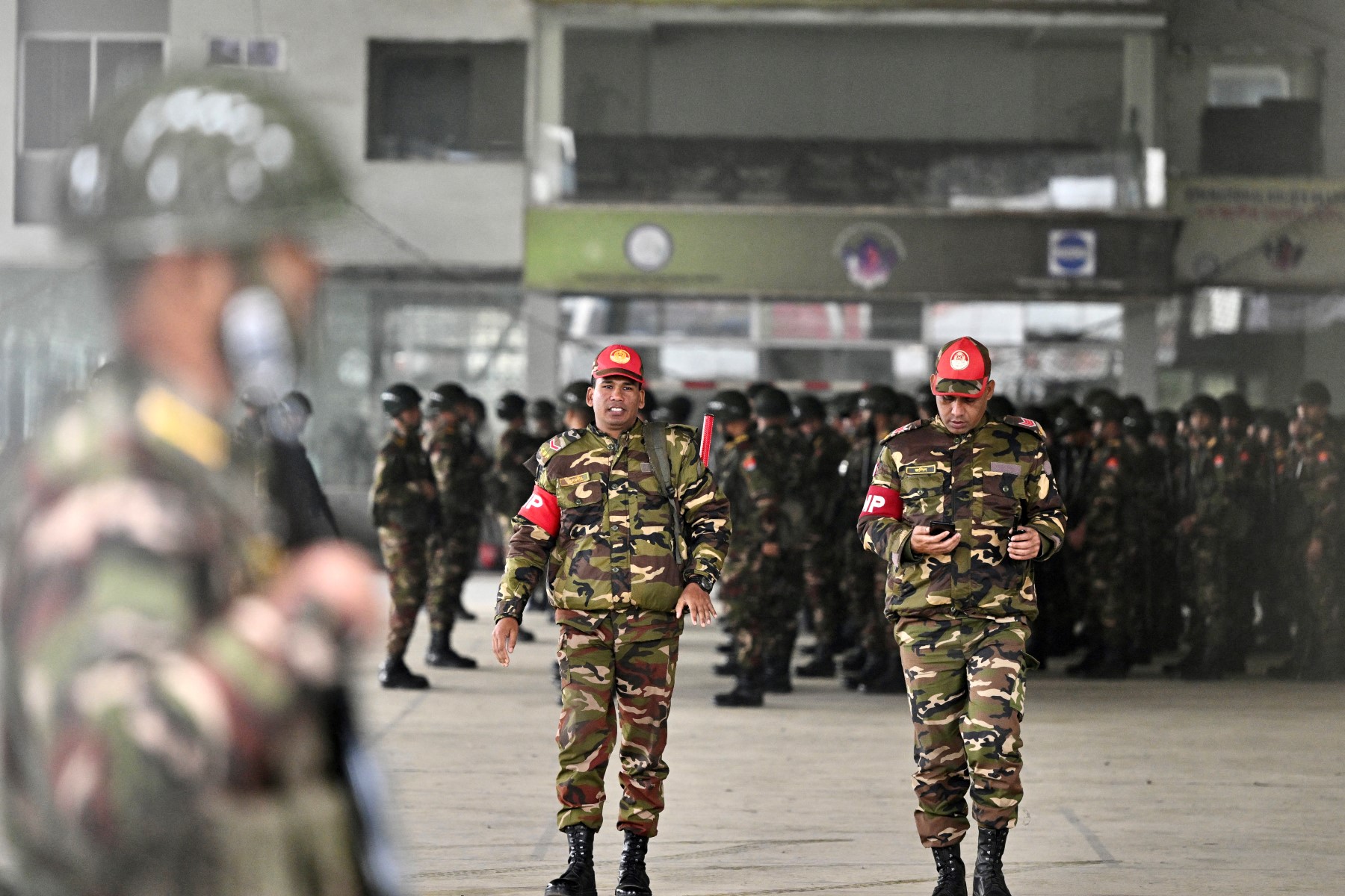 File photo of Bangladesh Army personnel gather at the Sheikh Russel Roller Skating Complex in Dhaka on January 3, 2024 after a nationwide deployment of armed forces to ensure security ahead of the upcoming January 7 national election (AFP)